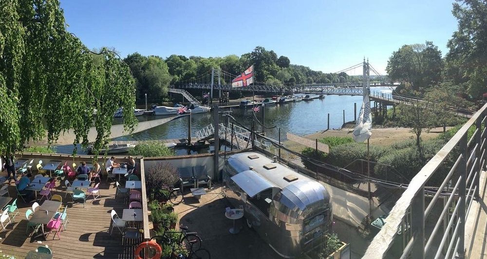 Aerial view of Flying Cloud Cafe, the terrace and the river